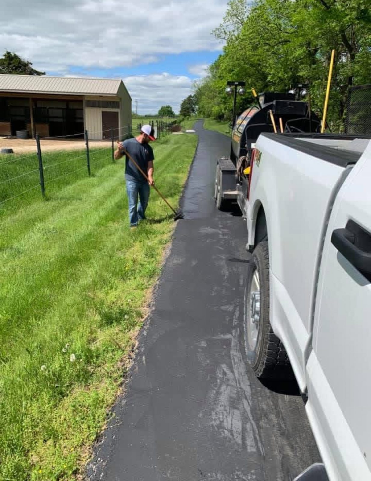 Sealcoating crew edge work by United Way Asphalt