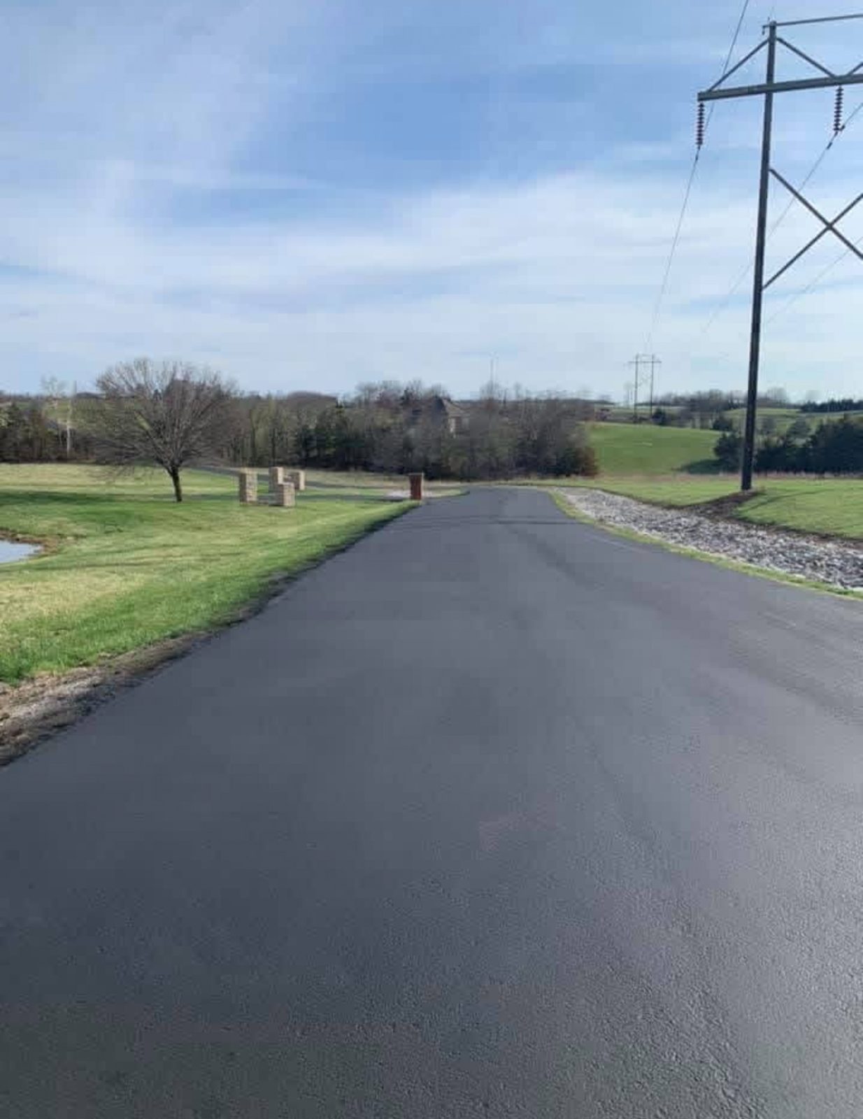 Sealcoating country driveway by United Way Asphalt