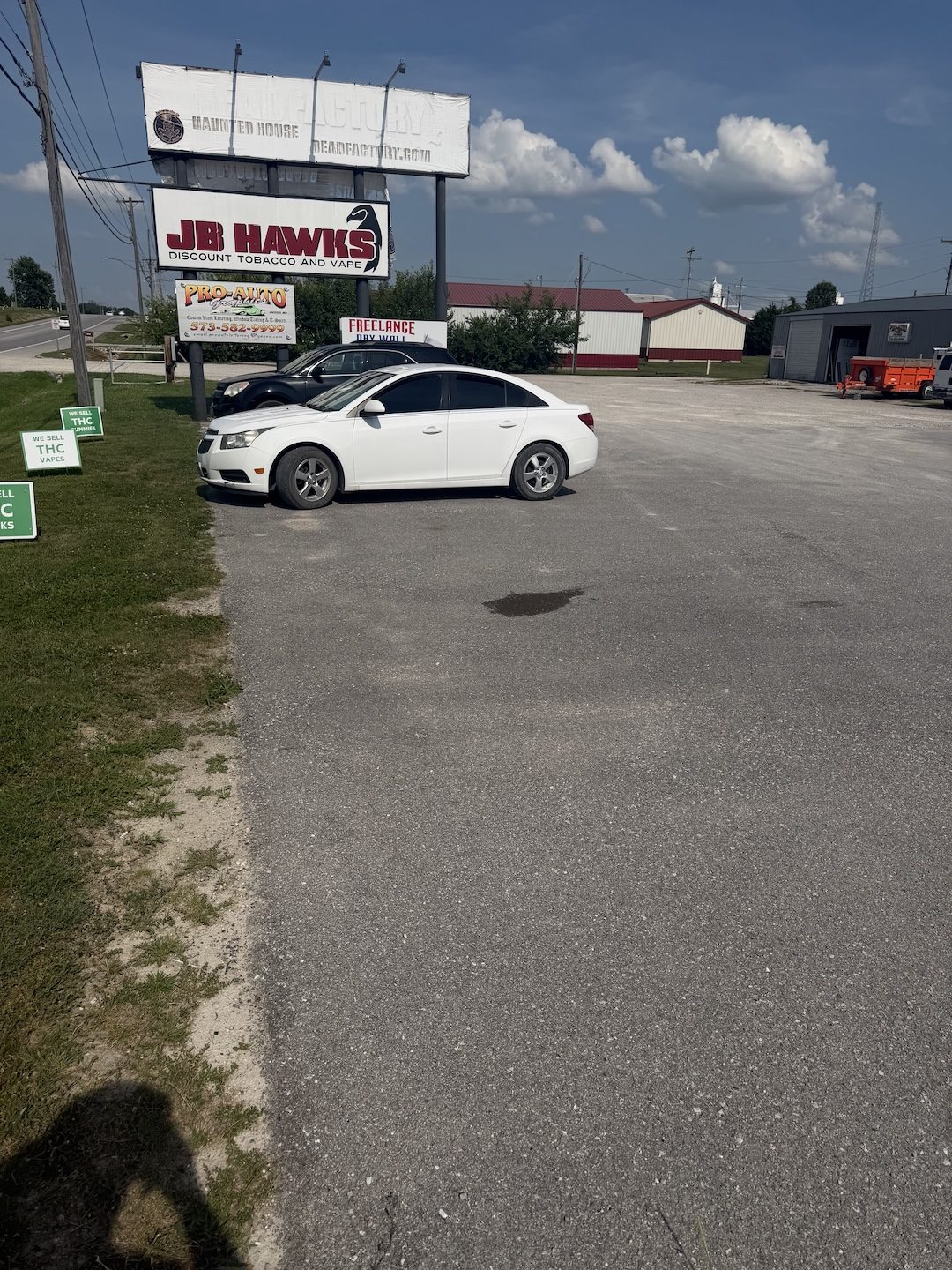 Before potholed commercial lot by United Way Asphalt