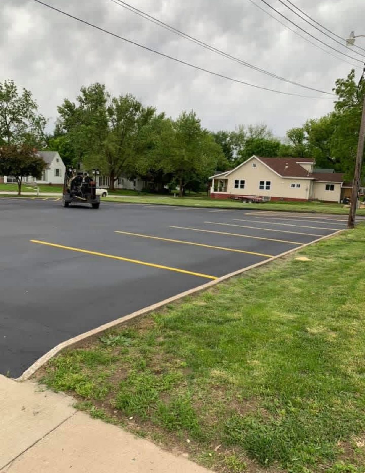 Striping yellow stalls by United Way Asphalt