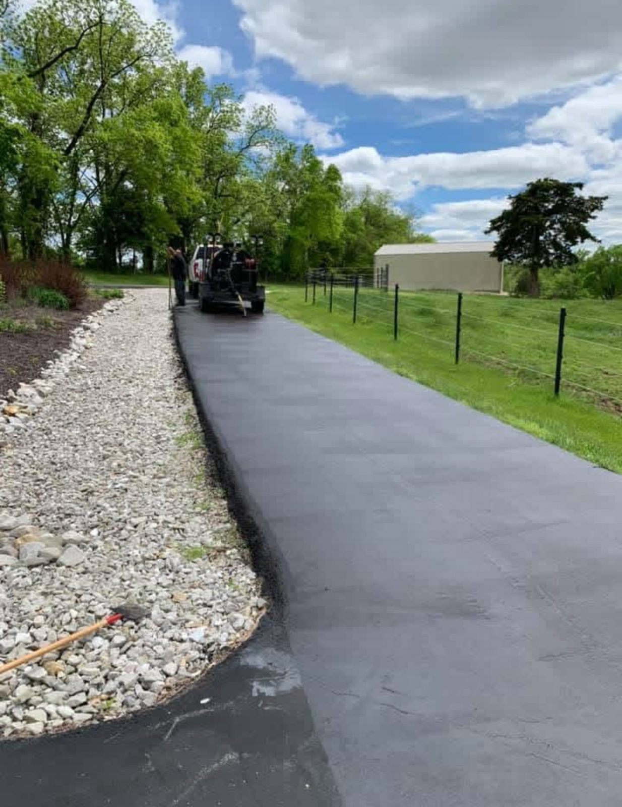 Sealcoating curved driveway by United Way Asphalt