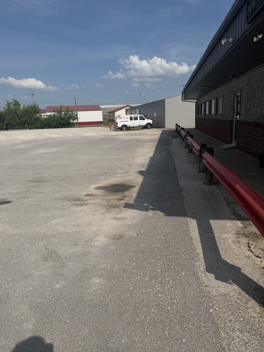Before patched commercial lot by United Way Asphalt