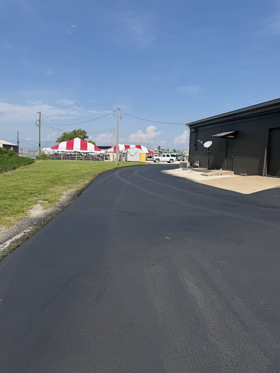 Paving commercial lot metal building by United Way Asphalt