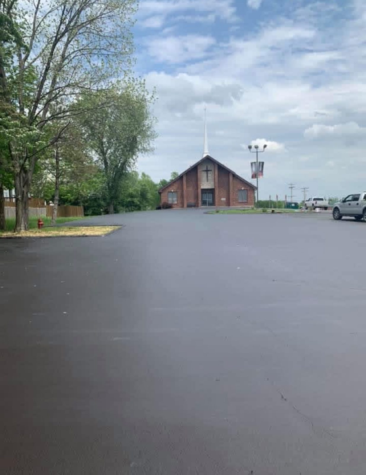 Commercial parking lot with a freshly sealcoated surface