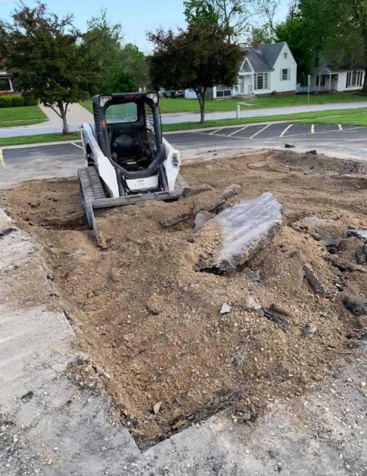 Paving equipment working on a prepared rural site