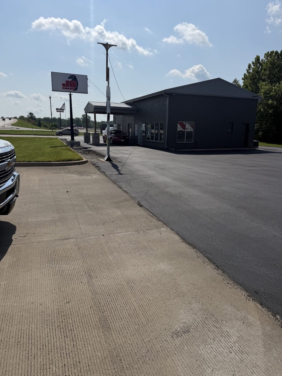 Paving commercial lot metal building by United Way Asphalt