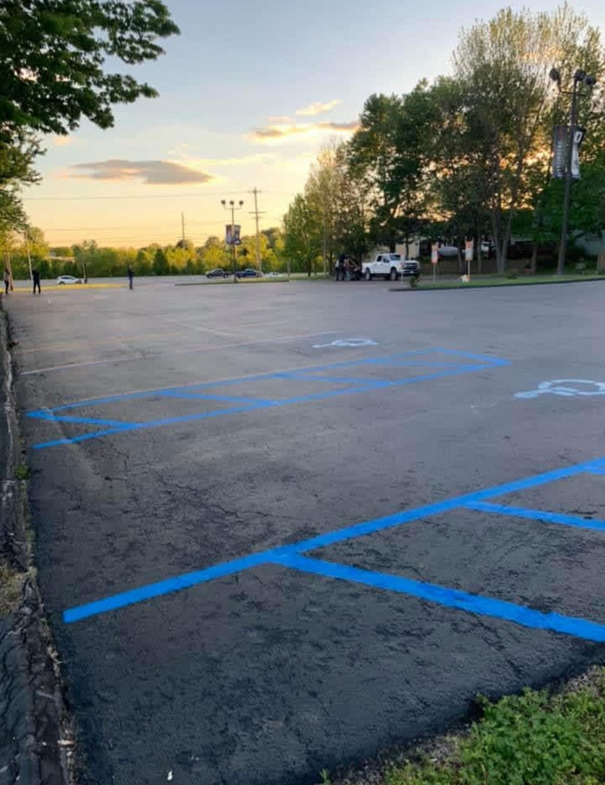 Striping accessible stall blue by United Way Asphalt