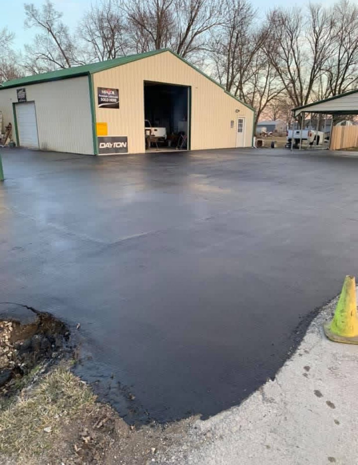 Sealcoating commercial shop lot by United Way Asphalt