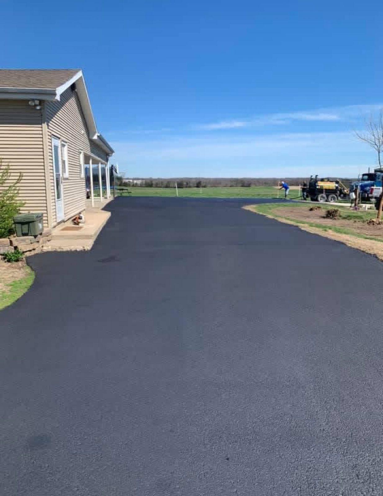 Freshly paved residential asphalt driveway