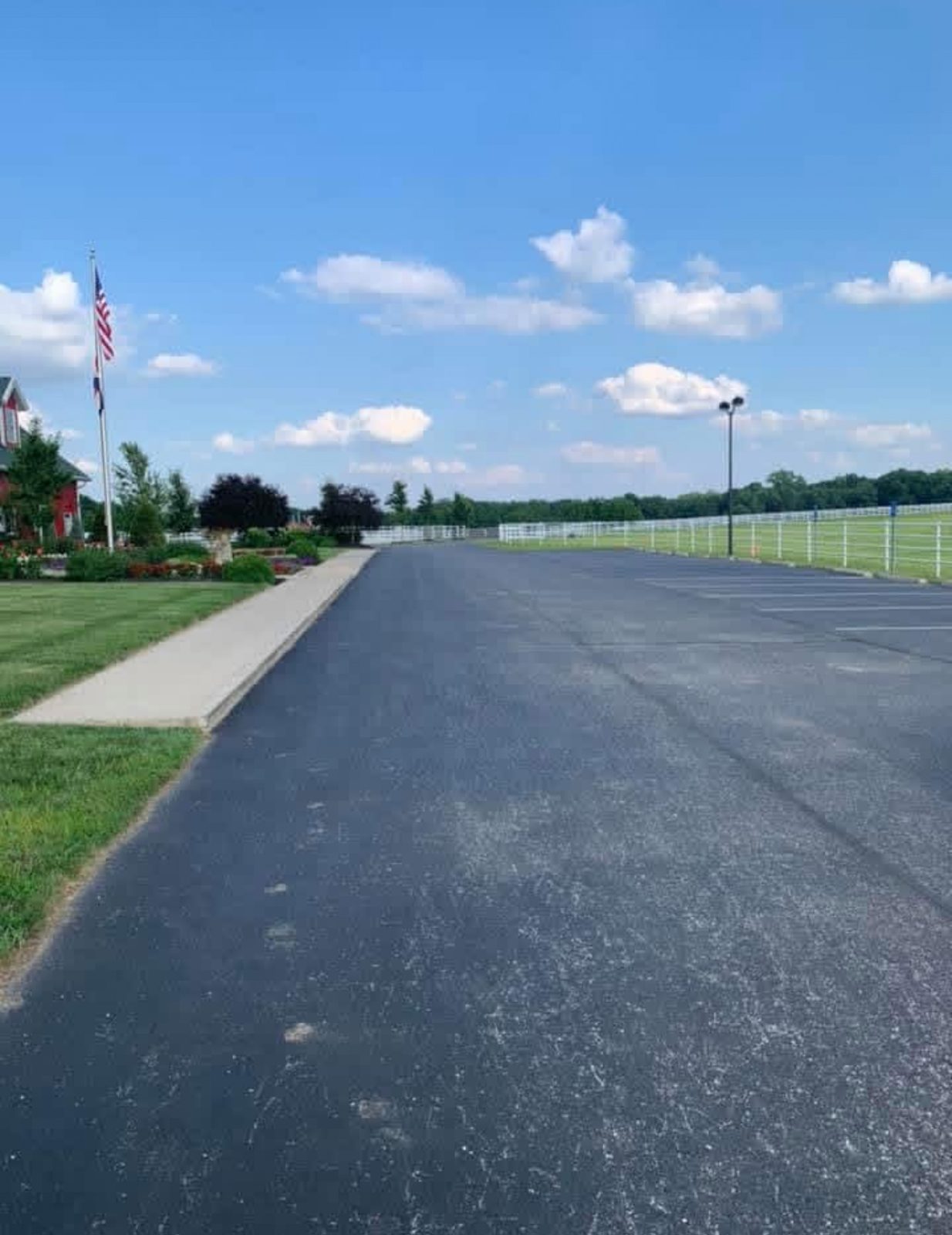 Paving commercial entrance drive by United Way Asphalt