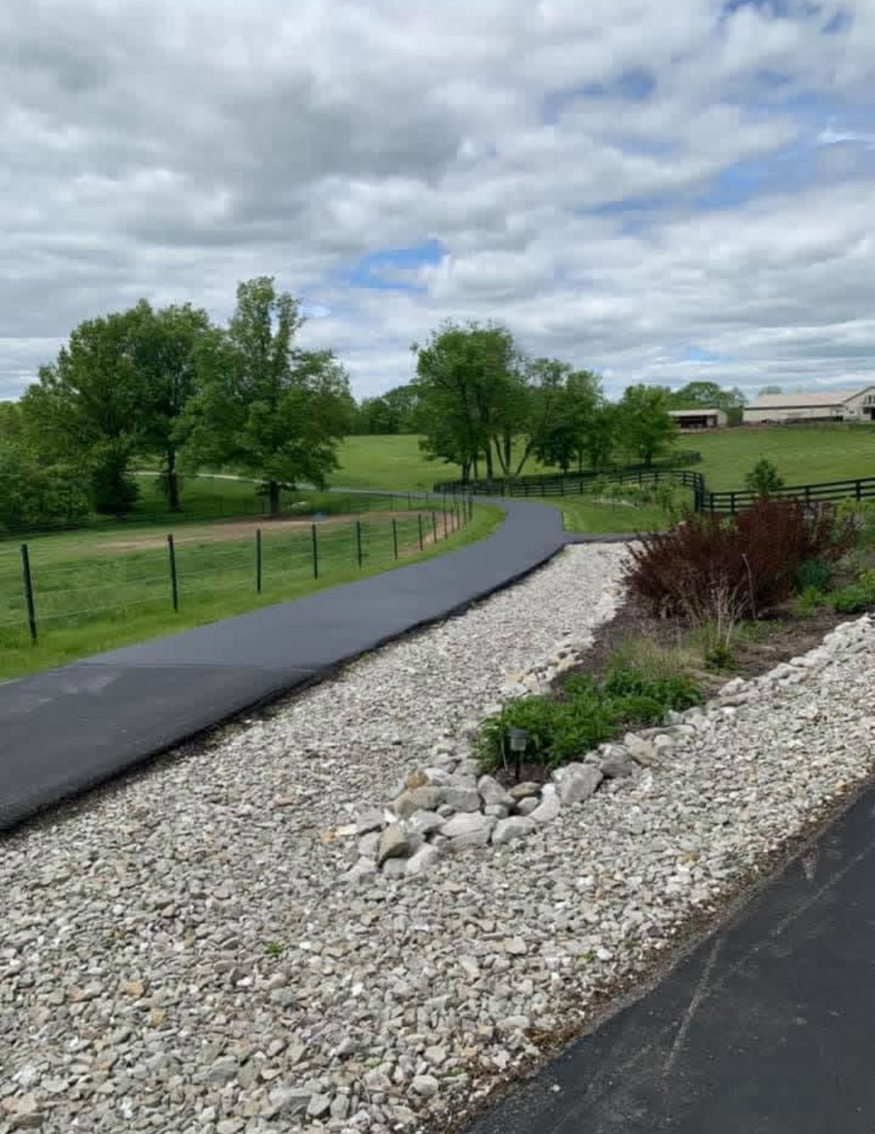 Sealcoating curved driveway by United Way Asphalt