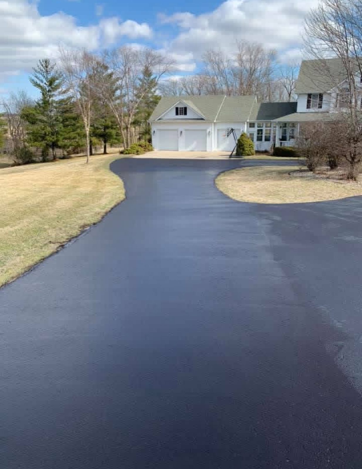 Freshly paved residential asphalt driveway