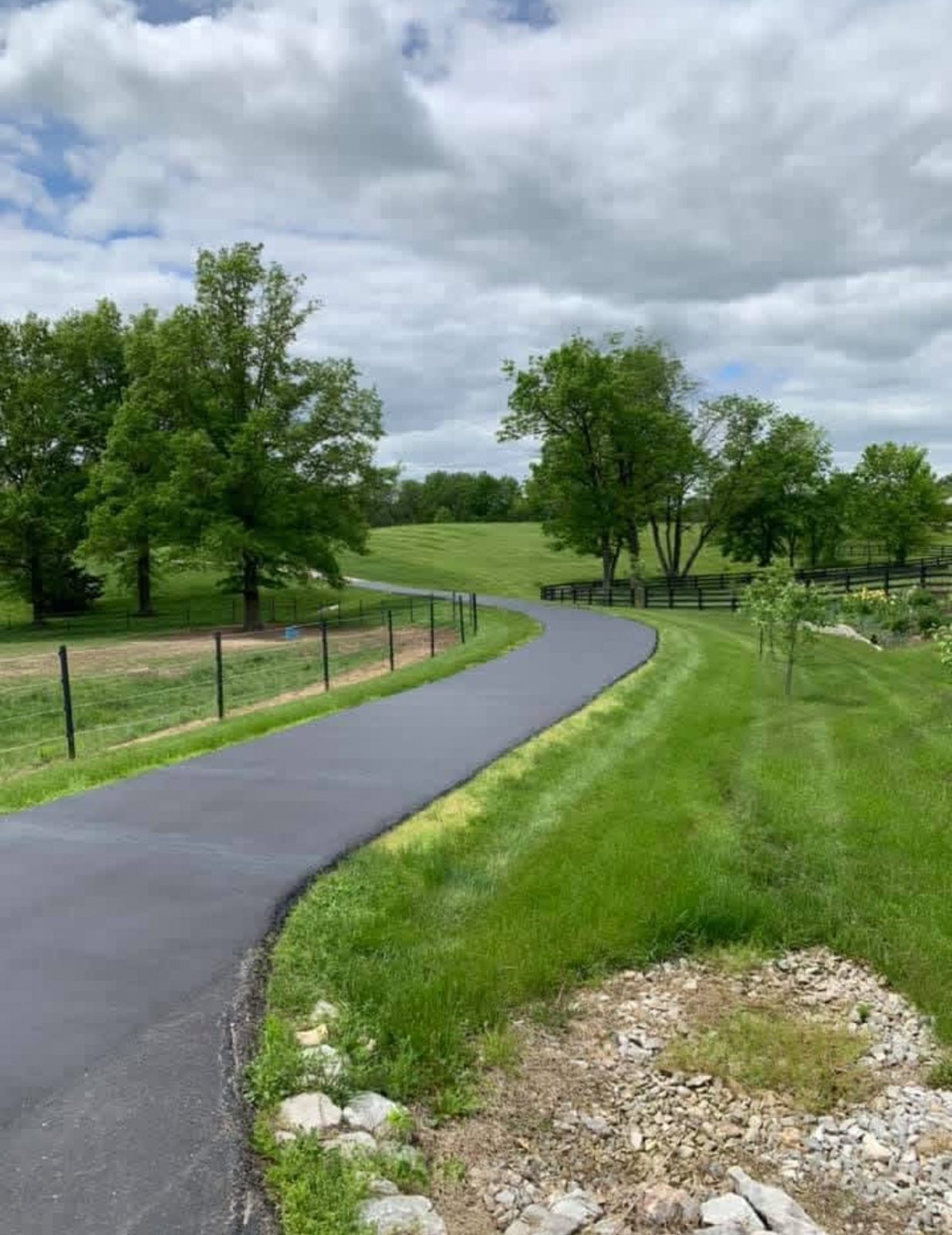 Sealcoating curved driveway by United Way Asphalt