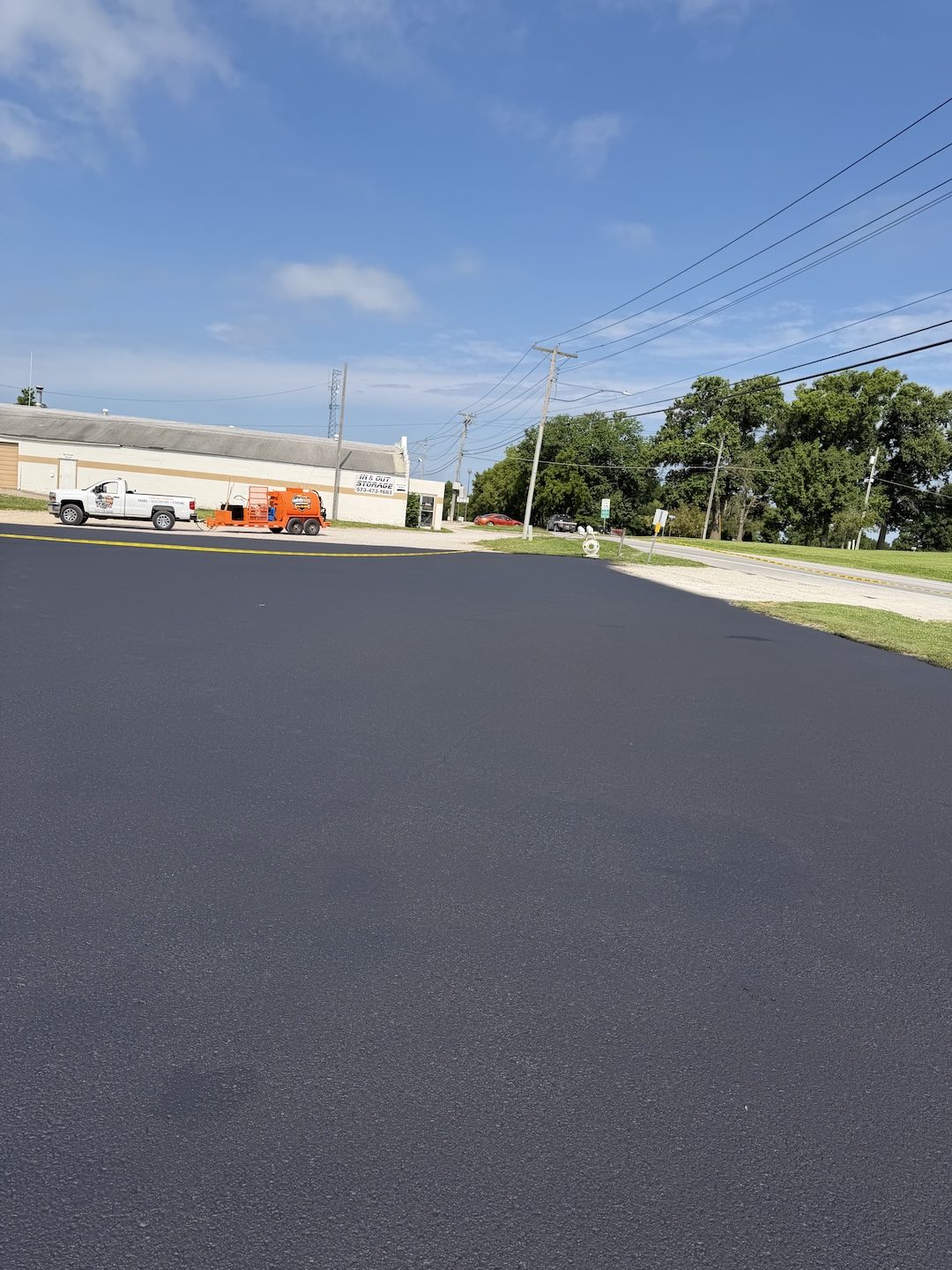 Paving commercial lot fresh surface by United Way Asphalt