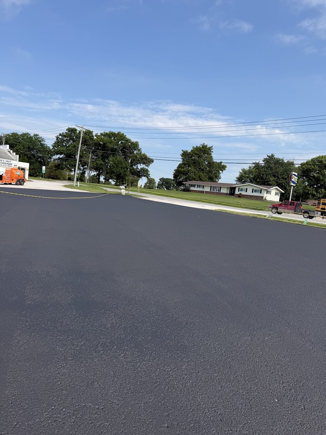 Paving commercial lot fresh surface by United Way Asphalt
